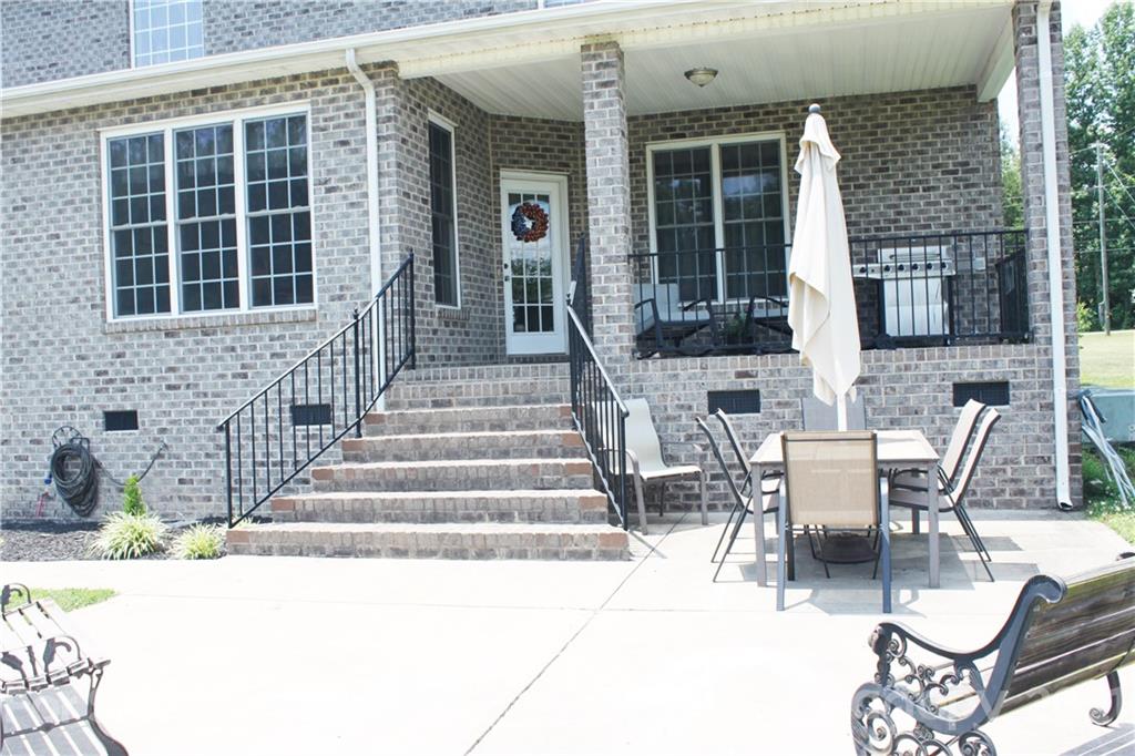 196 Cedar Grove Road York, SC 29745 - Photo 4 of 45 a balcony with table and chairs