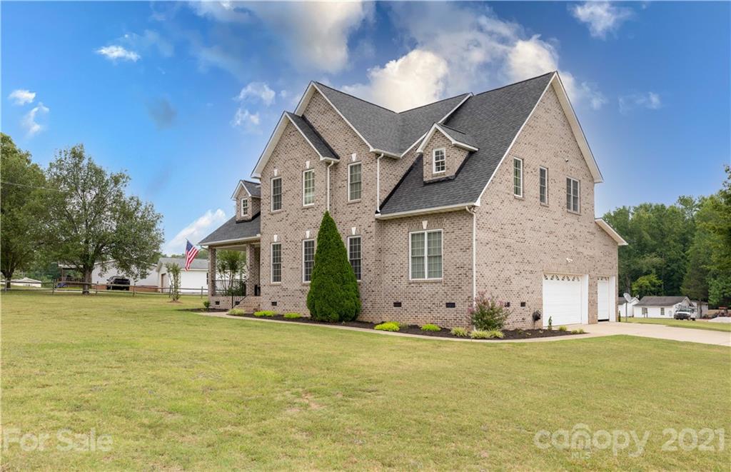 196 Cedar Grove Road York, SC 29745 - Photo 34 of 45 a front view of house with yard and trees in the background