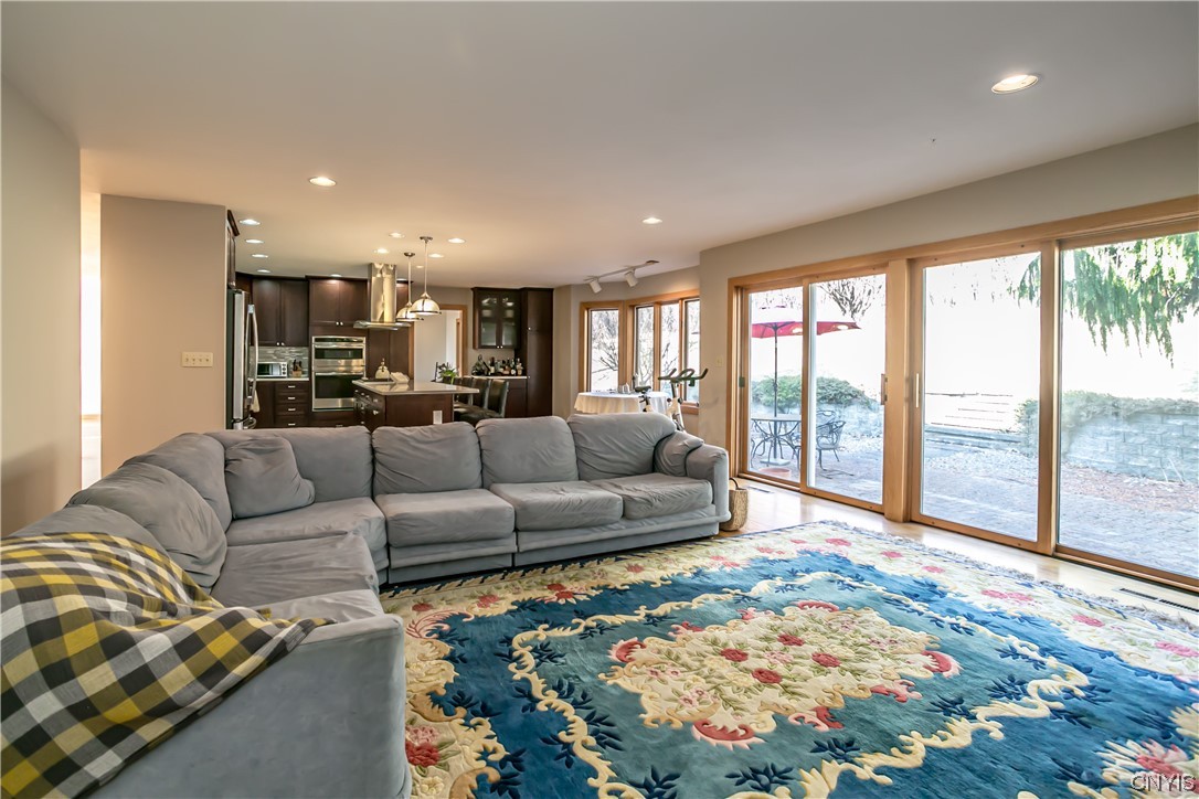 6104 Carnegie Drive Syracuse, NY 13224 - Photo 15 of 41 Wall of glass sliding doors from the kitchen and f