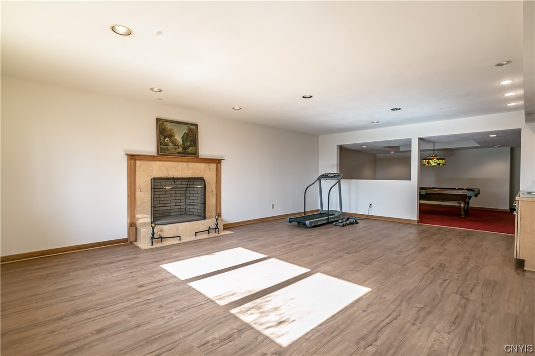 6104 Carnegie Drive Syracuse, NY 13224 - Photo 31 of 41 Lower level family room with woodburning fireplace