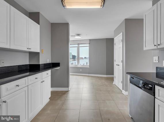 100 Harborview Drive, Unit 202 Baltimore, MD 21230 - Photo 11 of 25 a kitchen with granite countertop a stove a sink and a refrigerator