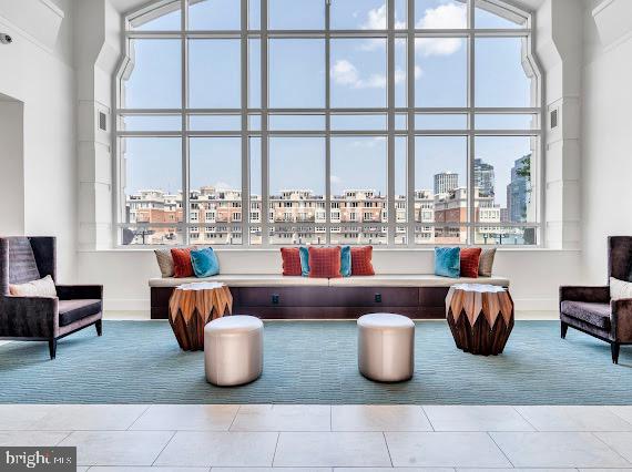 100 Harborview Drive, Unit 202 Baltimore, MD 21230 - Photo 23 of 25 a living room with furniture and a large window