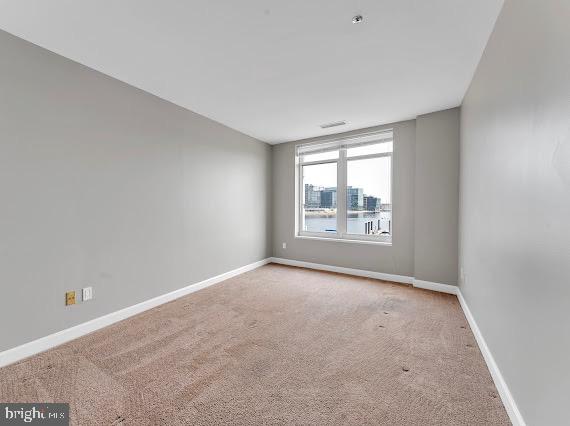 100 Harborview Drive, Unit 202 Baltimore, MD 21230 - Photo 5 of 25 an empty room with windows