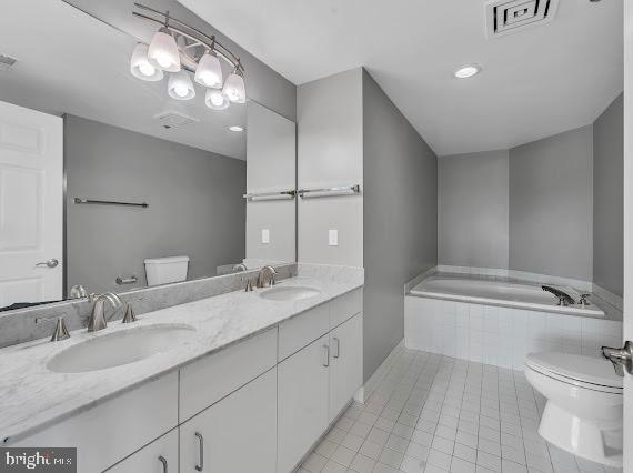 100 Harborview Drive, Unit 202 Baltimore, MD 21230 - Photo 9 of 25 a bathroom with a granite countertop sink mirror and toilet