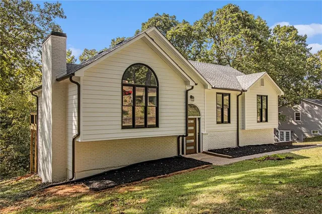 a front view of a house with a yard