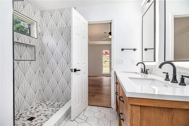 a bathroom with a sink and a mirror