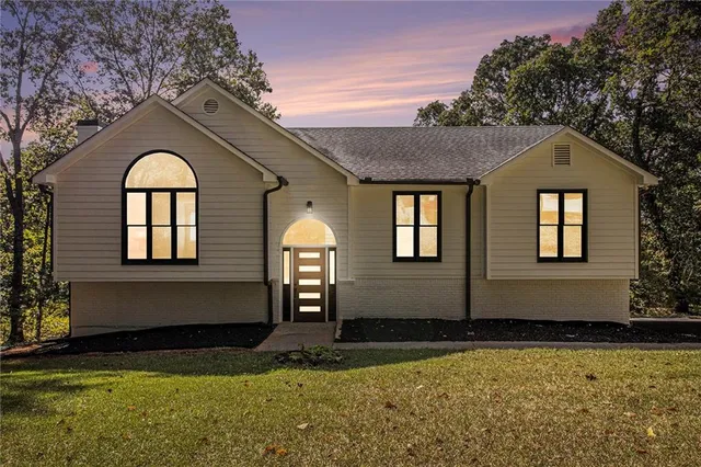 a front view of a house with garden