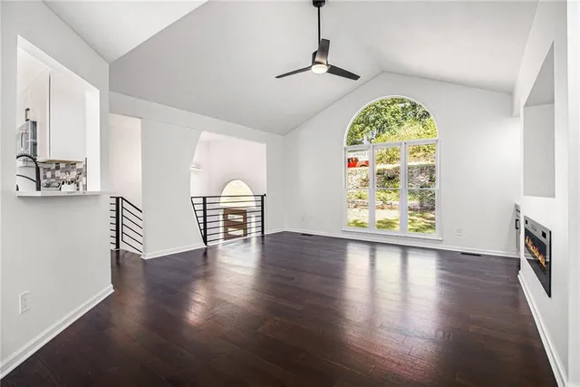 a view of an entryway with wooden floor