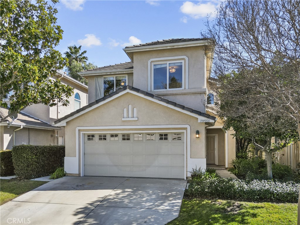 25558 Fitzgerald Avenue Stevenson Ranch, CA 91381 - Photo 2 of 55 front view of a house with a yard