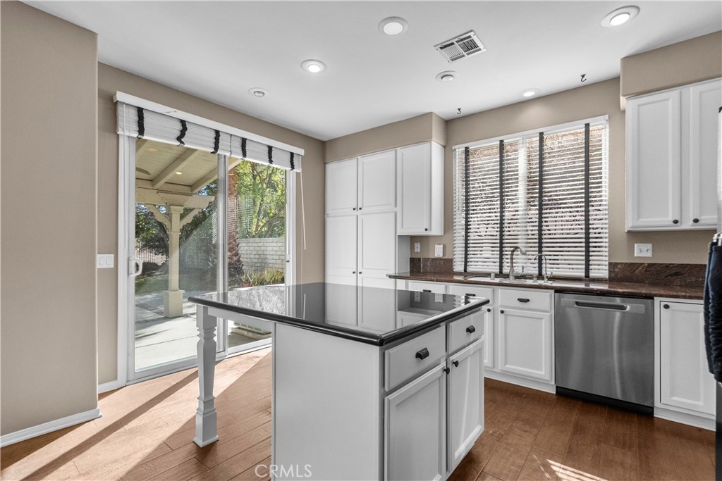 25558 Fitzgerald Avenue Stevenson Ranch, CA 91381 - Photo 22 of 55 a kitchen with stainless steel appliances granite countertop a stove and a sink