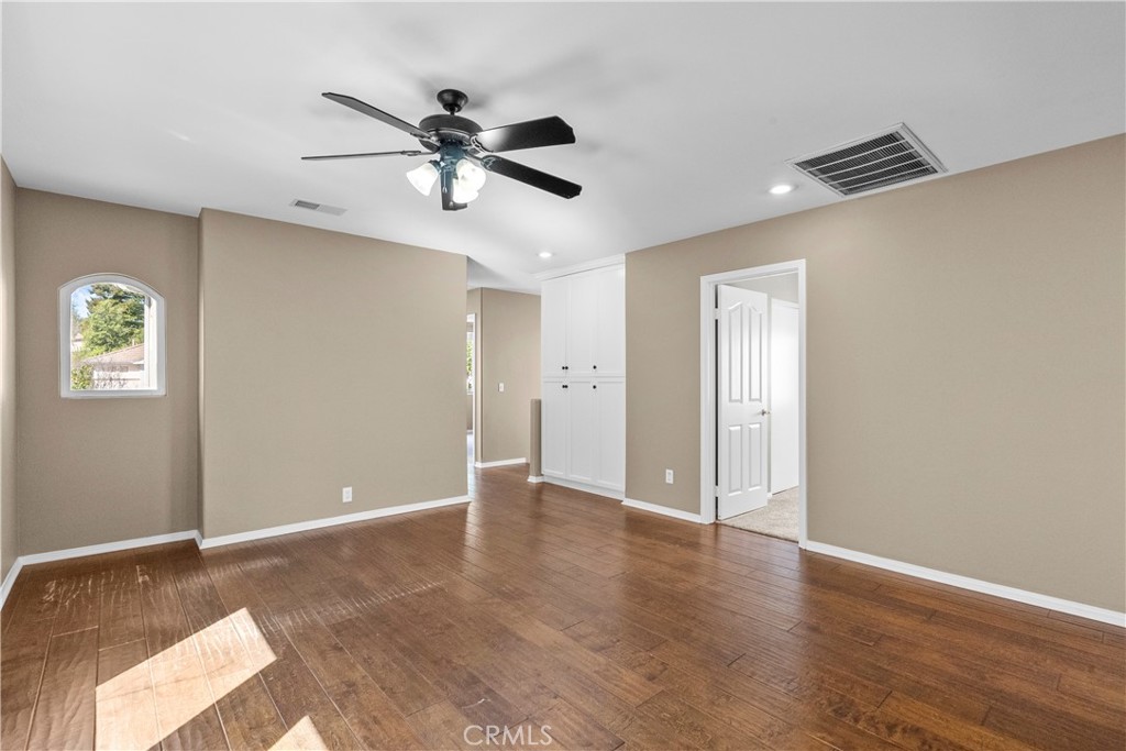 25558 Fitzgerald Avenue Stevenson Ranch, CA 91381 - Photo 31 of 55 a view of an empty room with wooden floor