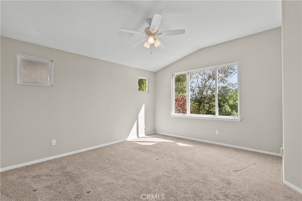 25558 Fitzgerald Avenue Stevenson Ranch, CA 91381 - Photo 33 of 55 a view of a big room with windows and chandelier fan