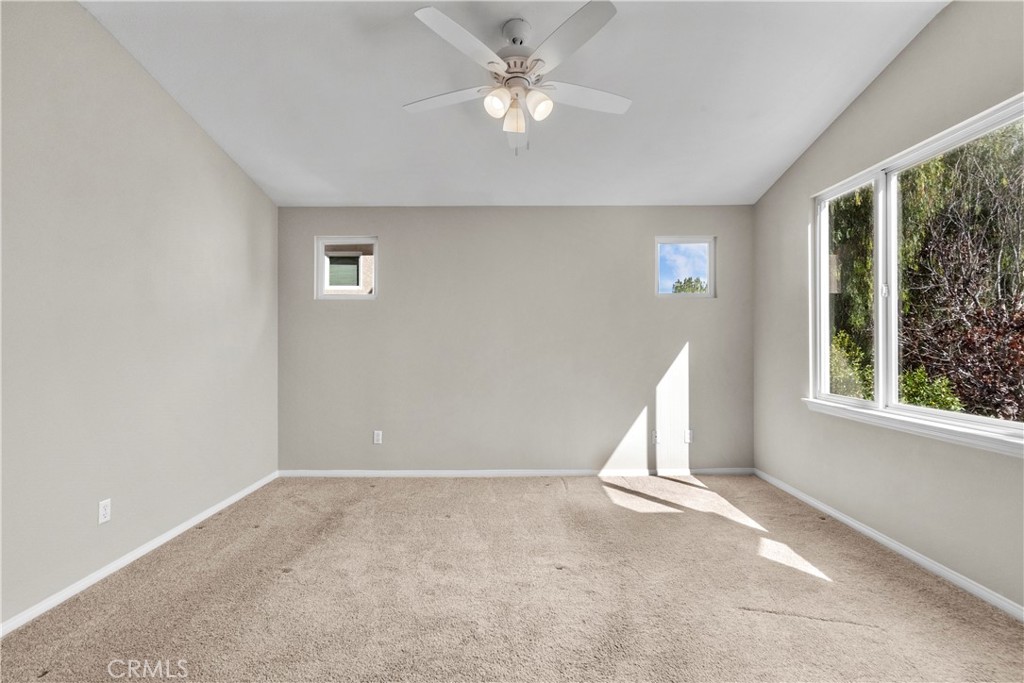 25558 Fitzgerald Avenue Stevenson Ranch, CA 91381 - Photo 34 of 55 an empty room with a window and a ceiling fan