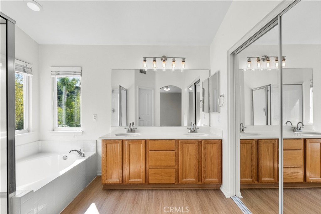 25558 Fitzgerald Avenue Stevenson Ranch, CA 91381 - Photo 37 of 55 a spacious bathroom with a tub shower and sink