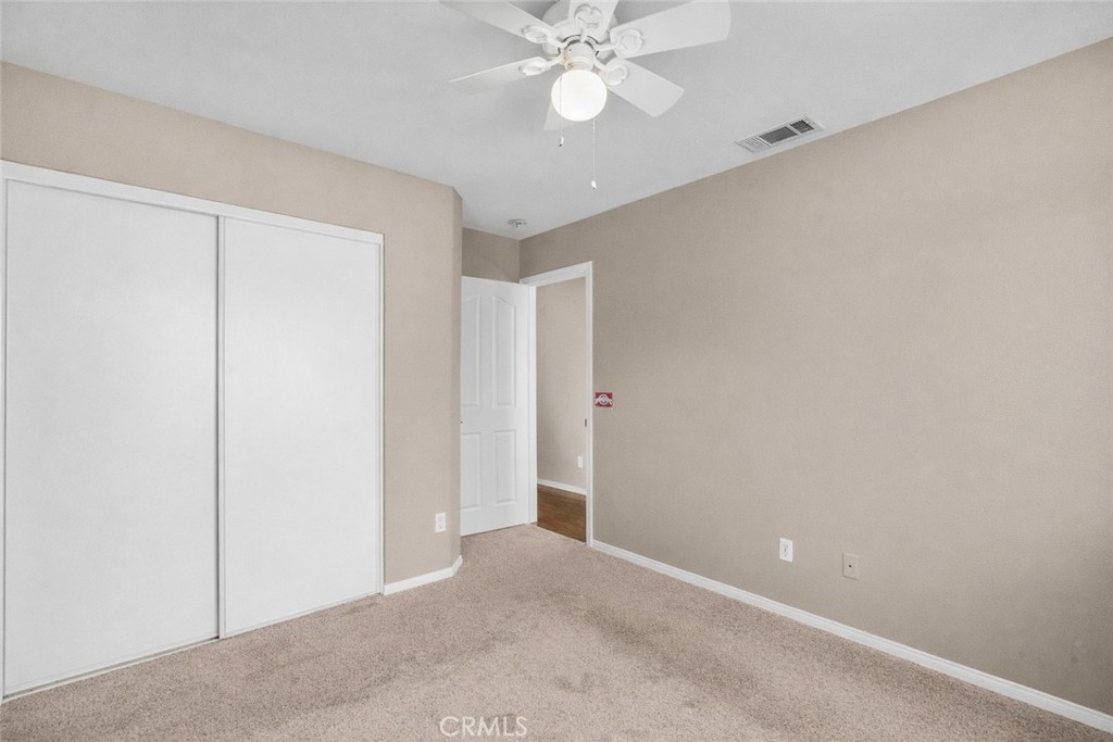 25558 Fitzgerald Avenue Stevenson Ranch, CA 91381 - Photo 39 of 55 a view of an empty room with a ceiling fan