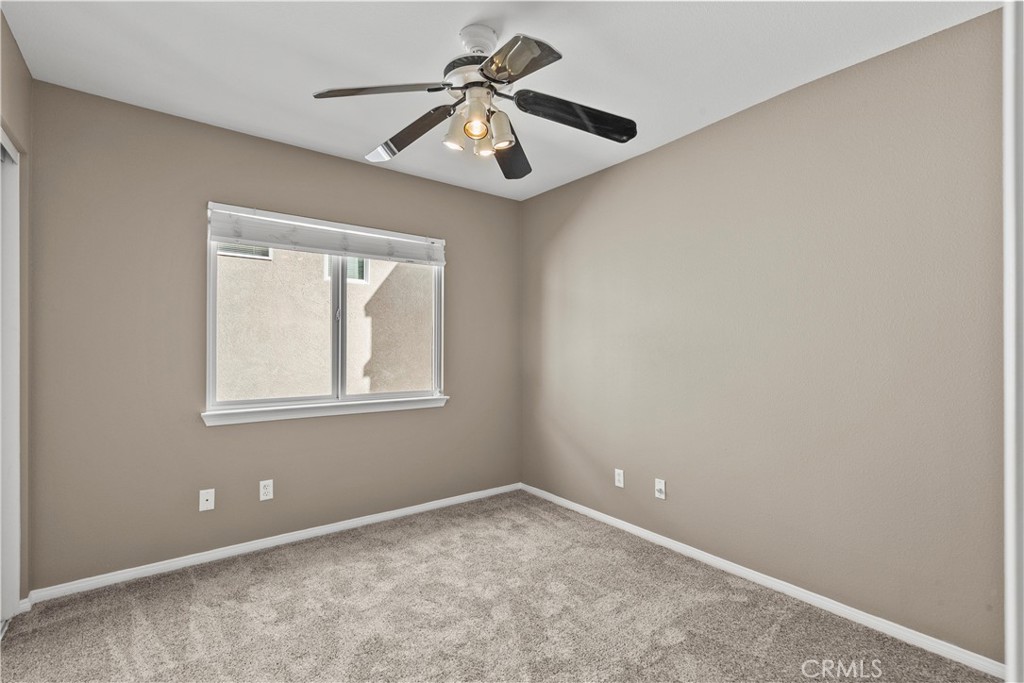 25558 Fitzgerald Avenue Stevenson Ranch, CA 91381 - Photo 44 of 55 an empty room with a window and a fan