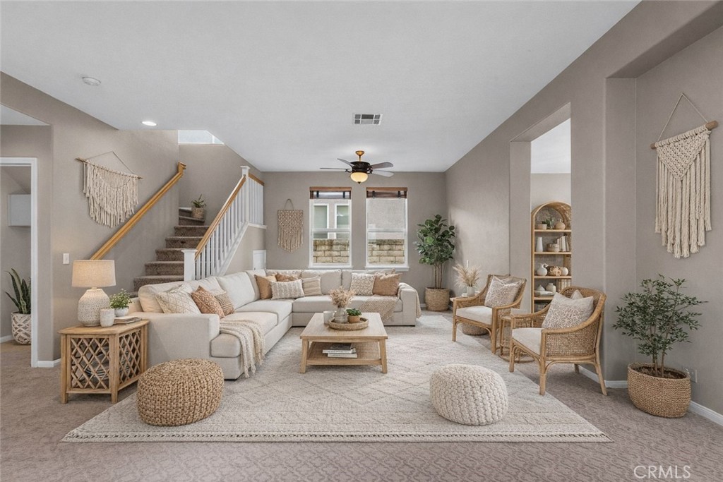 25558 Fitzgerald Avenue Stevenson Ranch, CA 91381 - Photo 9 of 55 a living room with furniture potted plant and windows
