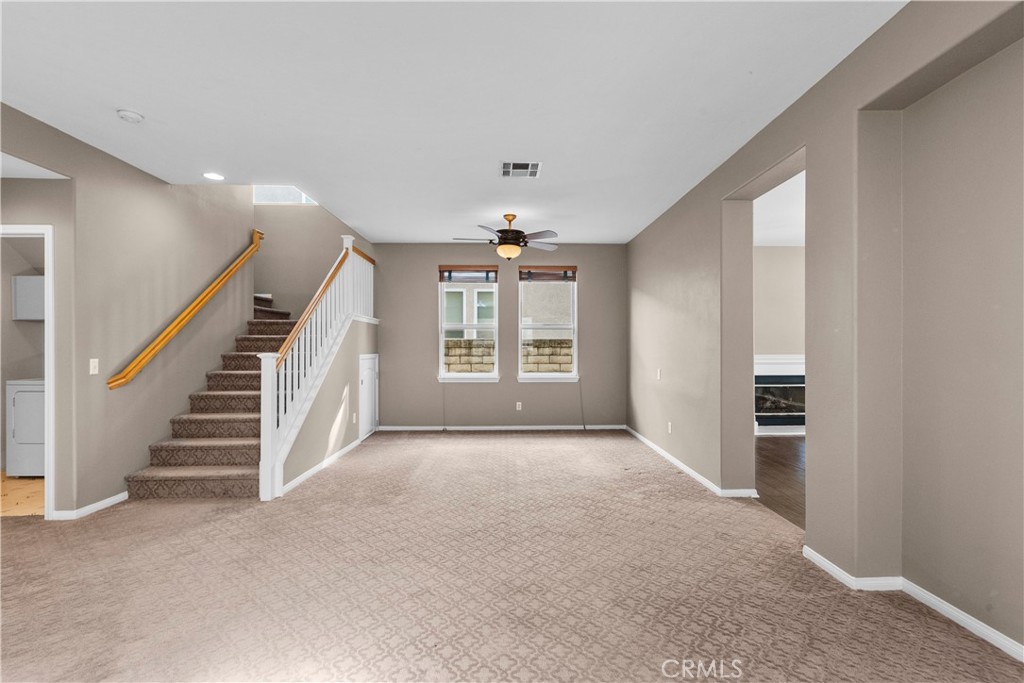 25558 Fitzgerald Avenue Stevenson Ranch, CA 91381 - Photo 10 of 55 a view of a livingroom with a staircase