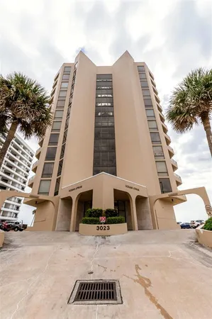 a view of a tall building with large windows