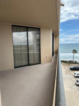 a view of a living room and a balcony