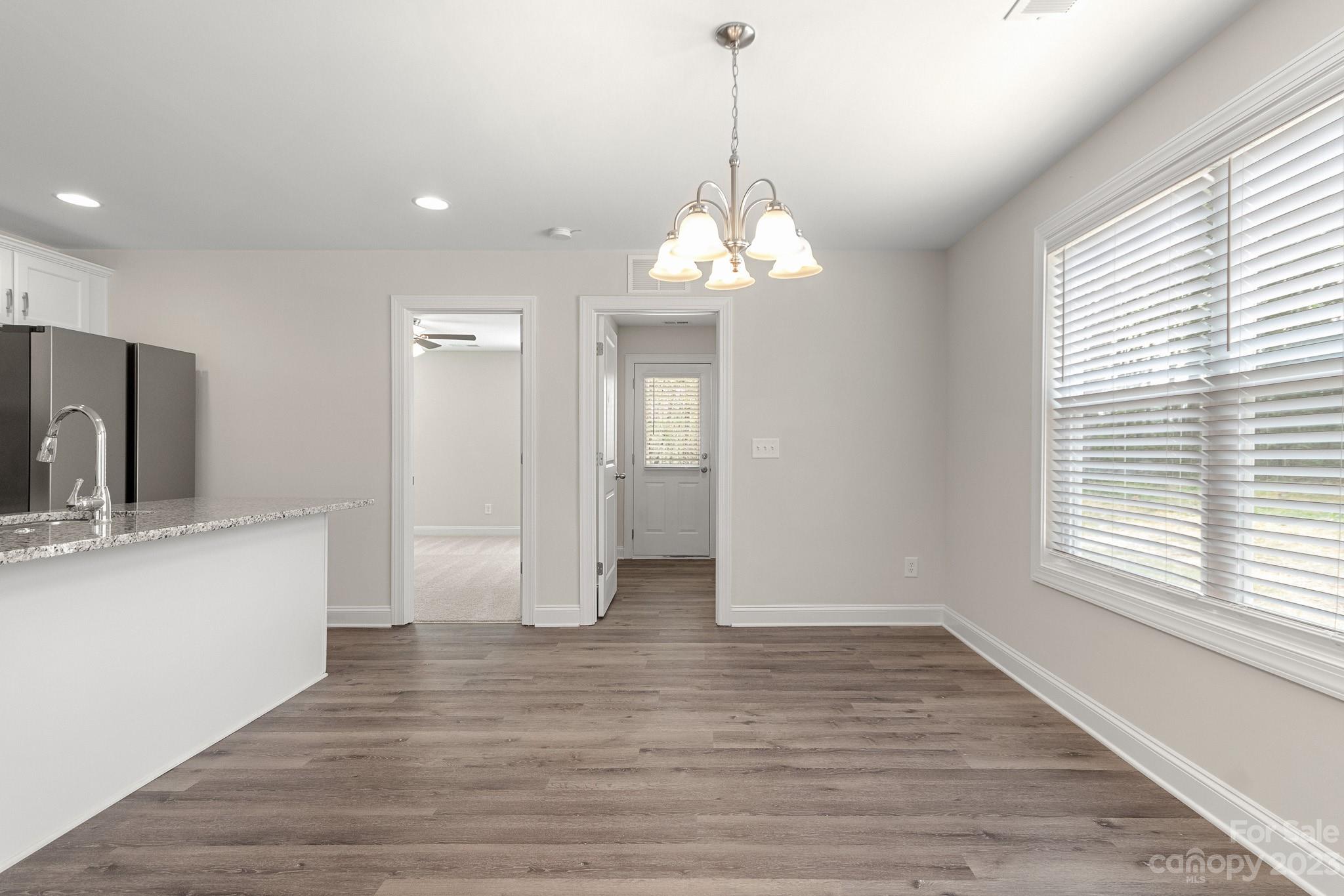 318 Springhill Lane Maiden, NC 28650 - Photo 15 of 40 a view of a sink and a chandelier in a room