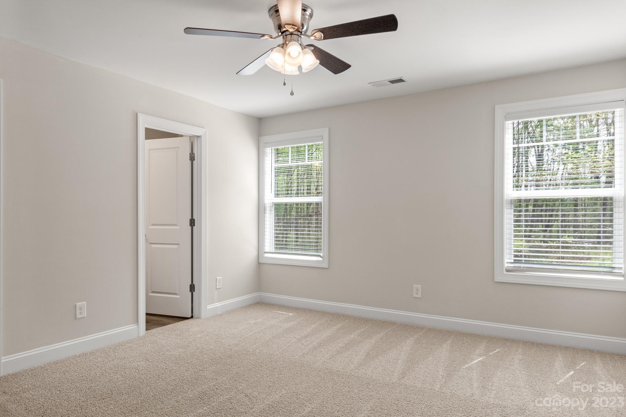318 Springhill Lane Maiden, NC 28650 - Photo 18 of 40 an empty room with windows and fan