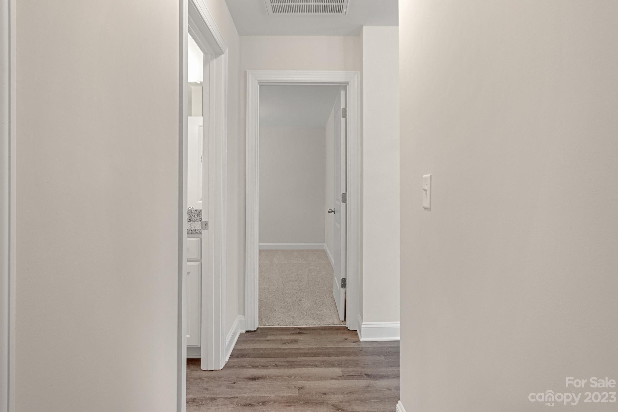 318 Springhill Lane Maiden, NC 28650 - Photo 26 of 40 a view of a hallway with wooden floor