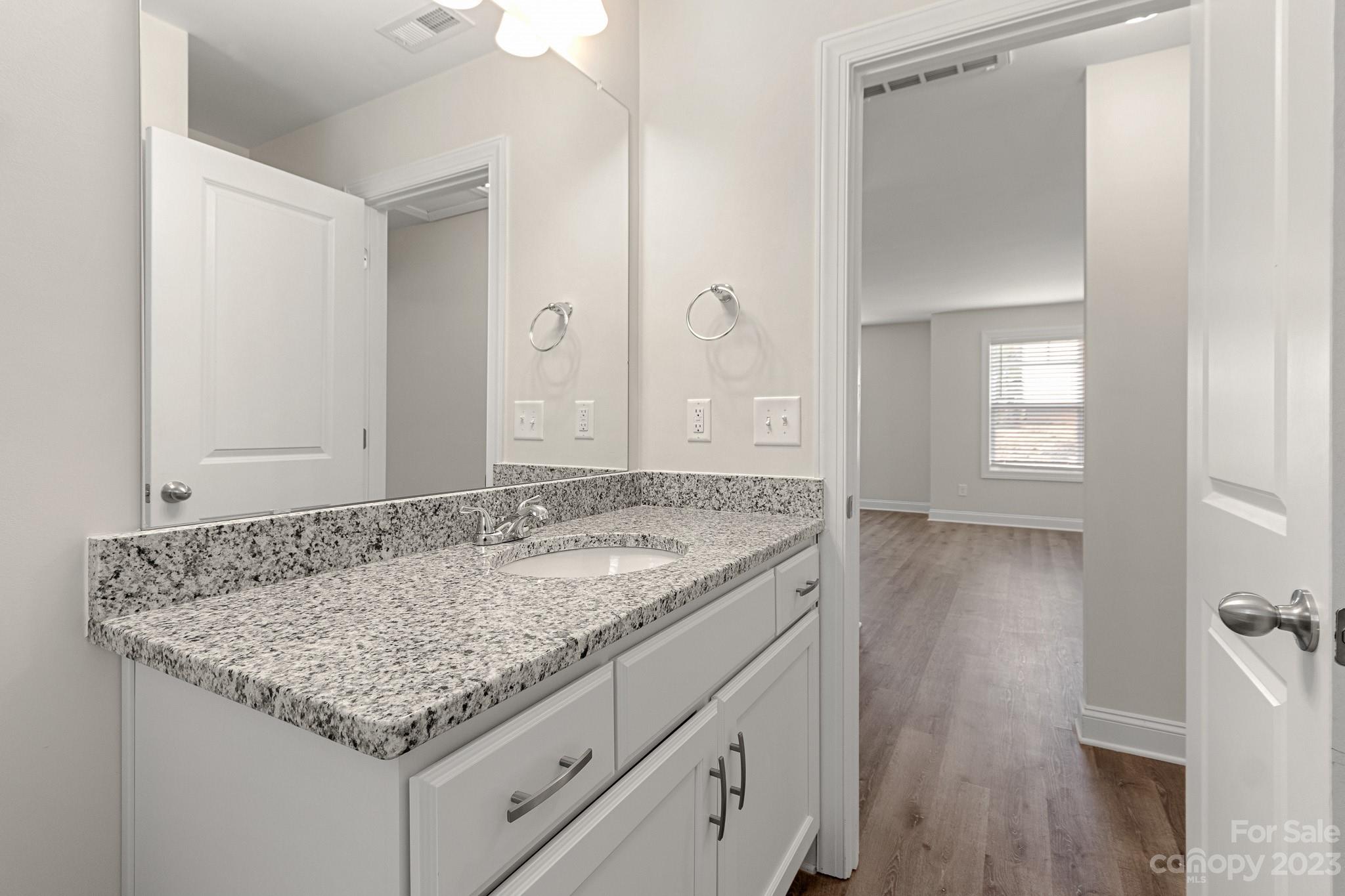 318 Springhill Lane Maiden, NC 28650 - Photo 30 of 40 a bathroom with a granite countertop sink and a mirror