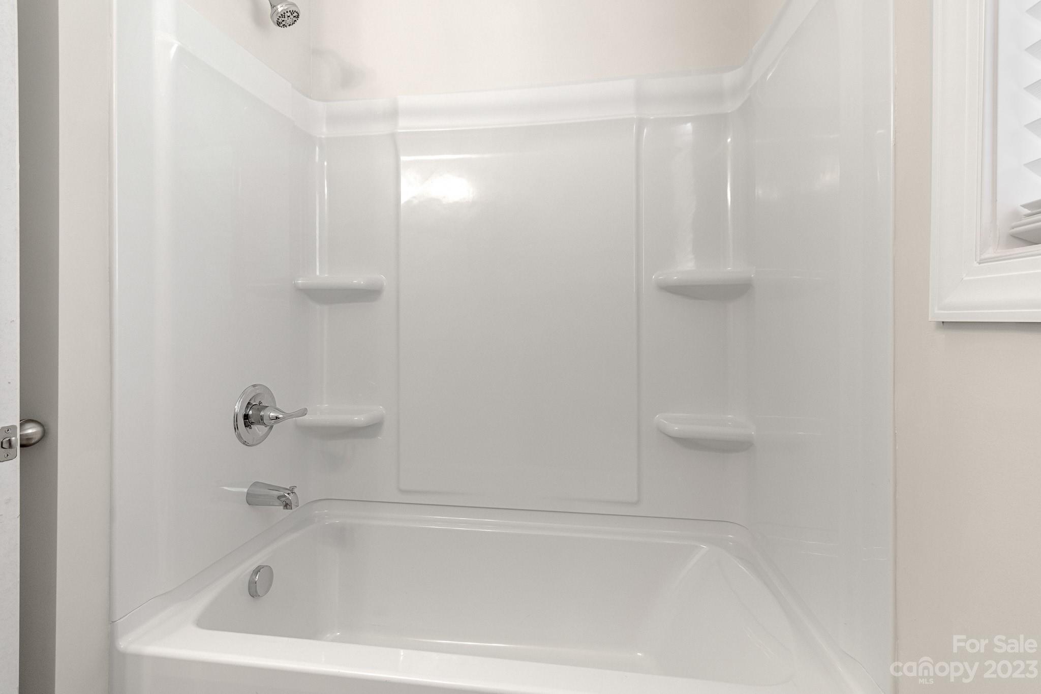 318 Springhill Lane Maiden, NC 28650 - Photo 32 of 40 a white bath tub sitting next to a shower