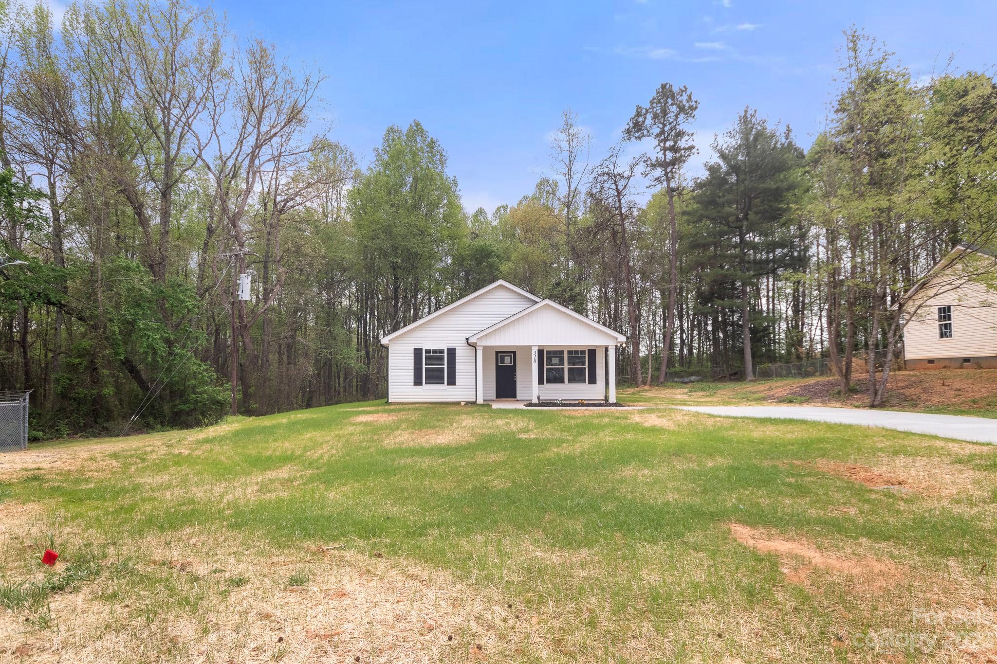318 Springhill Lane Maiden, NC 28650 - Photo 36 of 40 a view of a large house with a big yard and large trees