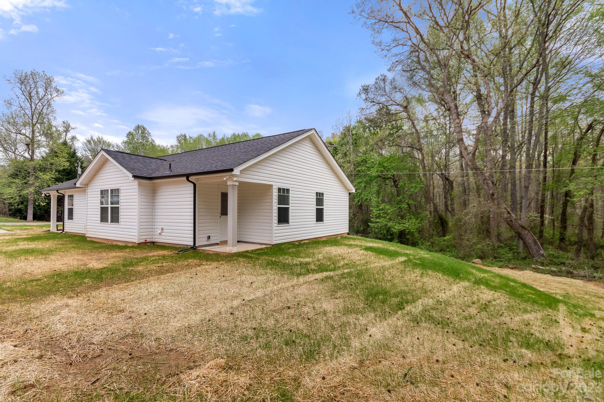 318 Springhill Lane Maiden, NC 28650 - Photo 39 of 40 a view of a house with backyard and trees