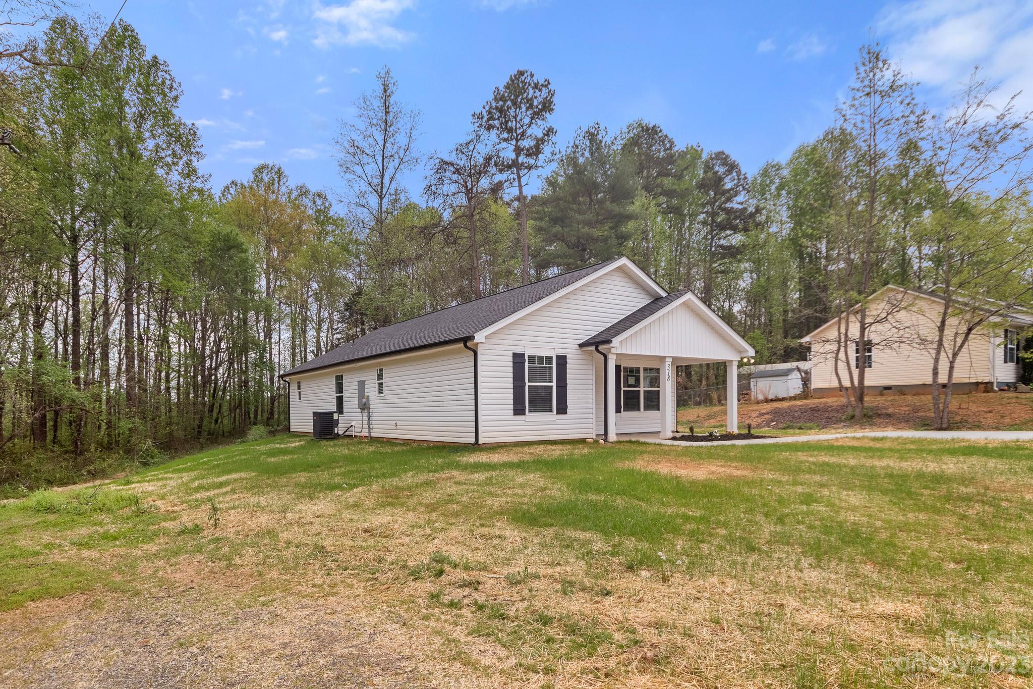 318 Springhill Lane Maiden, NC 28650 - Photo 40 of 40 a big house with a big yard and large trees