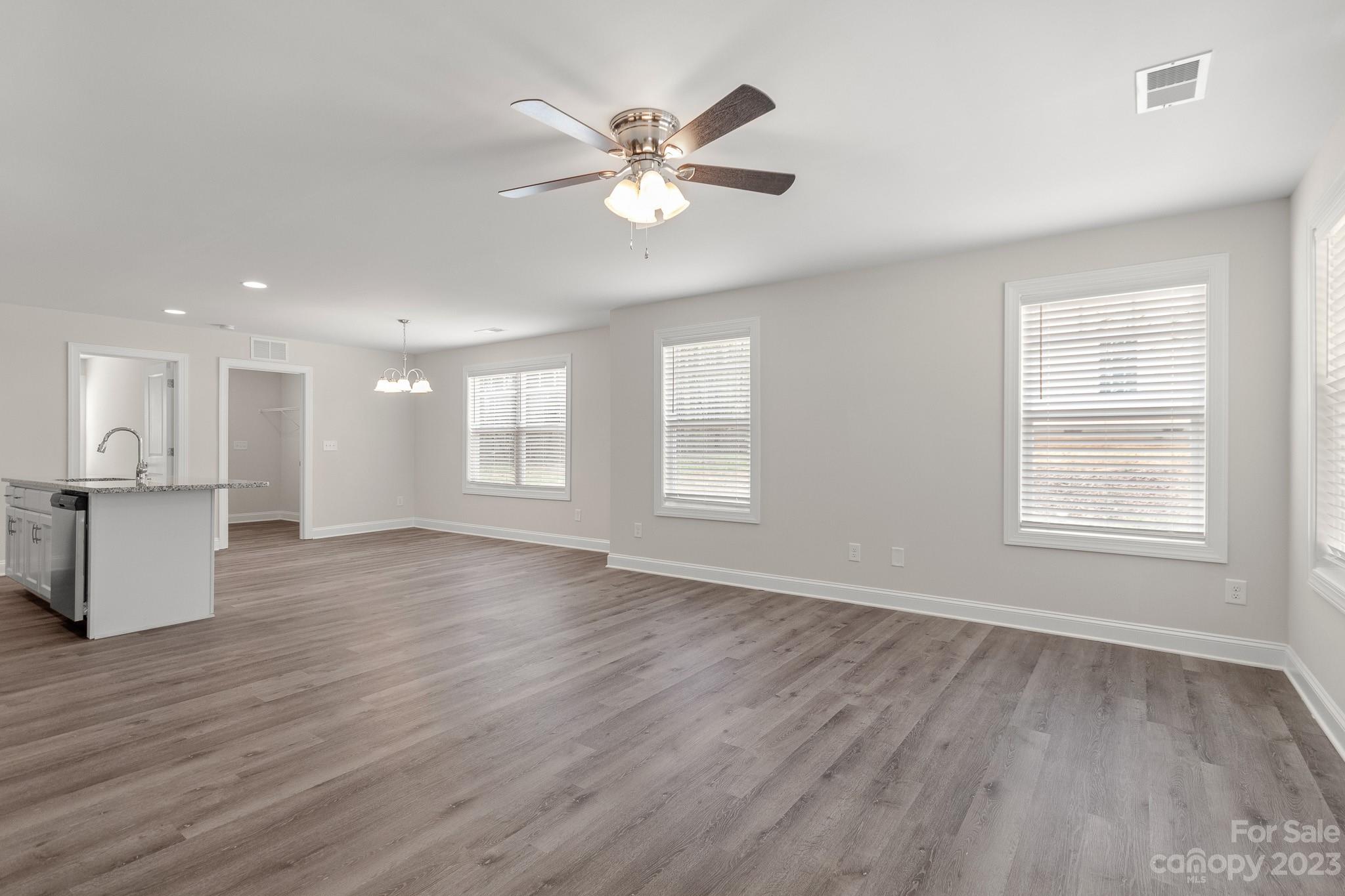 318 Springhill Lane Maiden, NC 28650 - Photo 6 of 40 a view of an empty room with wooden floor and a window