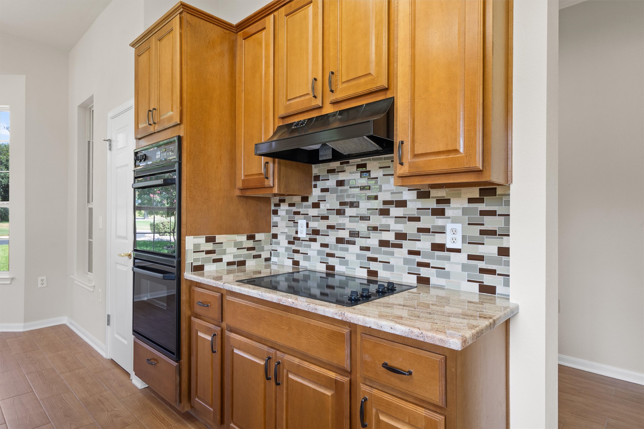 108 Cattle Trail Way Georgetown, TX 78633 - Photo 14 of 40 Electric Cooktop. There is a gas connection for easy change out.
