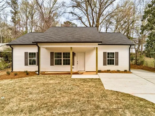 a house with yard in front of it