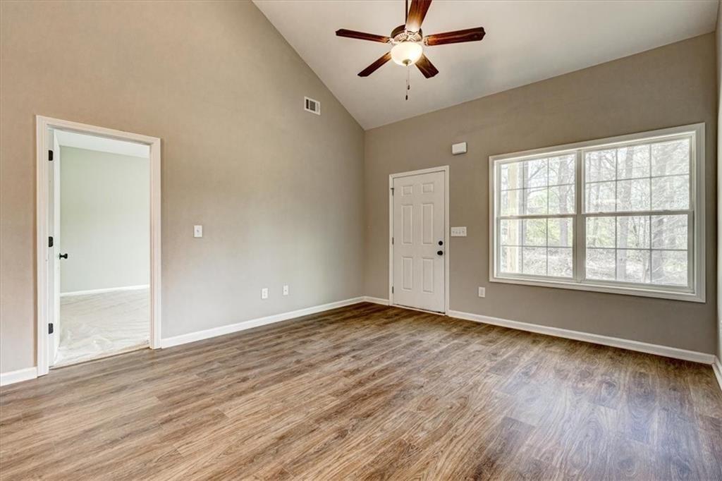 207 Loftis Road Temple, GA 30179 - Photo 4 of 14 wooden floor in an empty room with a window