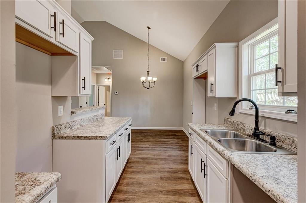 207 Loftis Road Temple, GA 30179 - Photo 9 of 14 a bathroom with a granite countertop double vanity sink and mirror