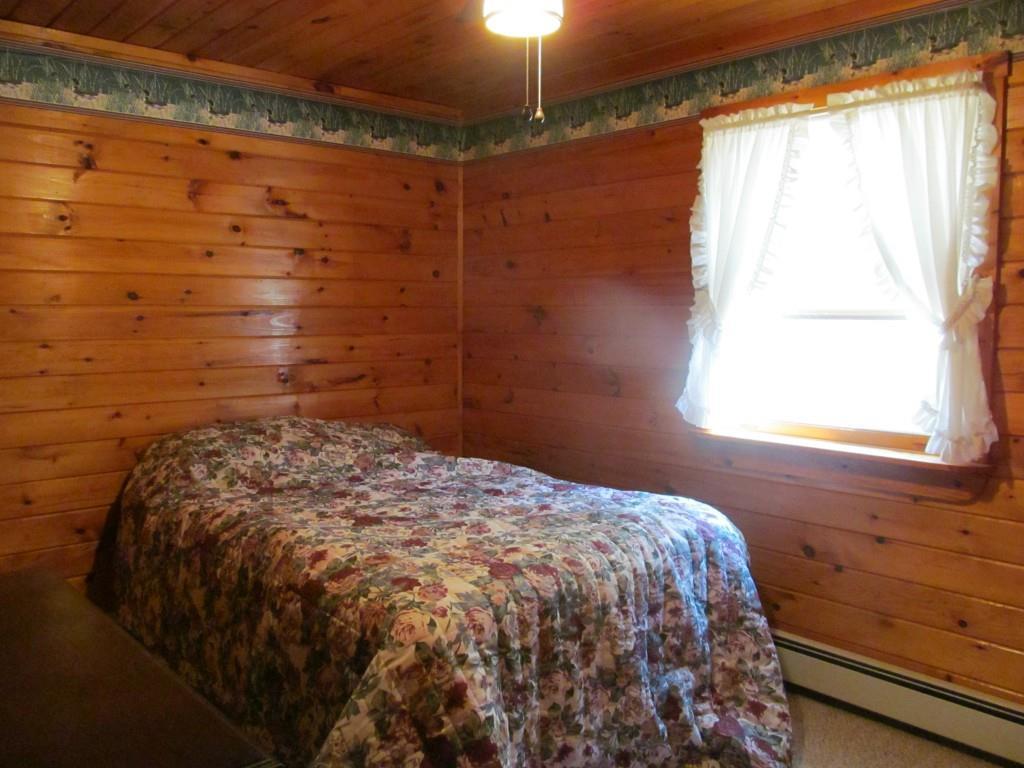 381 Gebung Road Alfred, ME 04002 - Photo 16 of 18 Bedroom w/ knotty pine walls and...