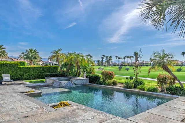 a view of swimming pool from a yard