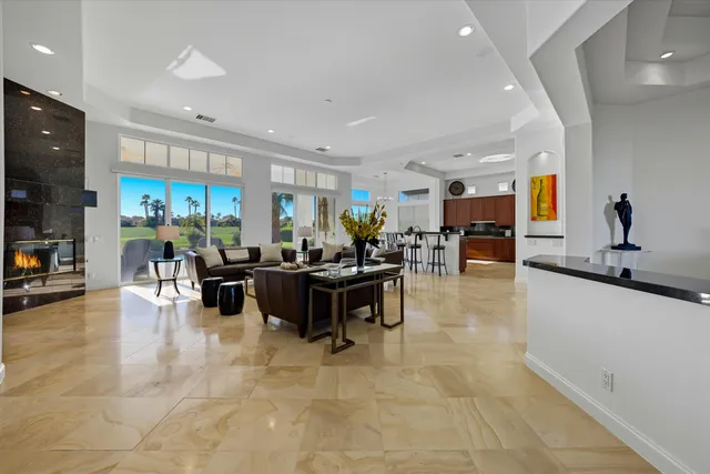 a living room with fireplace furniture and a flat screen tv