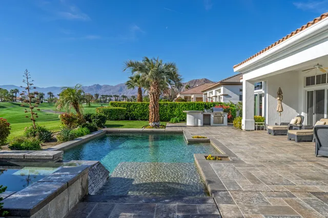 a view of a swimming pool with a patio
