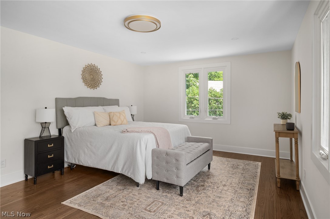 22625 Rye Road Shaker Heights, OH 44122 - Photo 19 of 38 Spacious room featuring hardwood flooring, white baseboards, and neutral wall paint