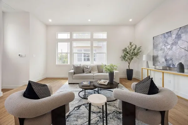 a living room with furniture and a large window