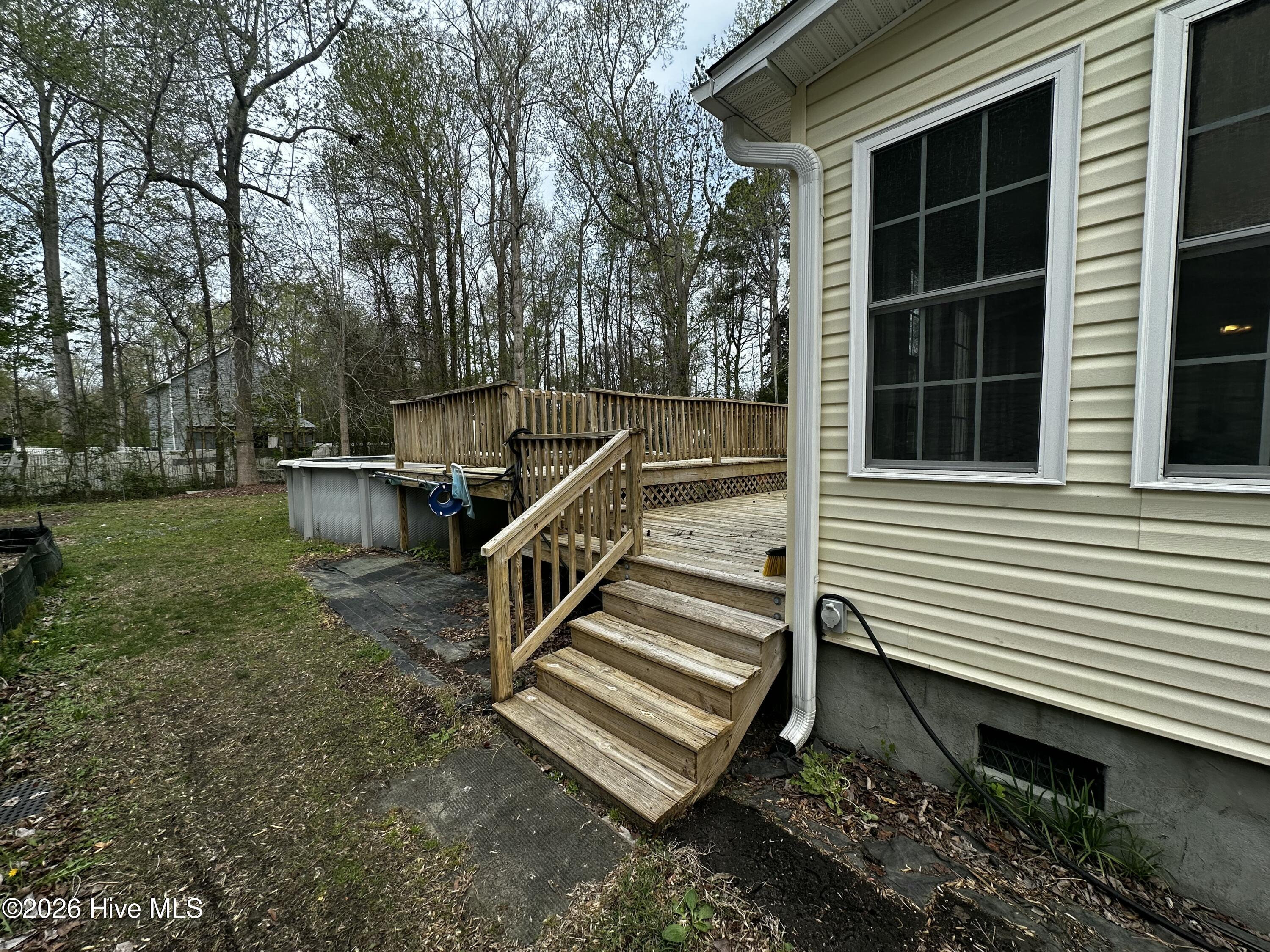 209 Old Ironsides Road Newport, NC 28570 - Photo 5 of 52 Stairs to rear deck from side of house