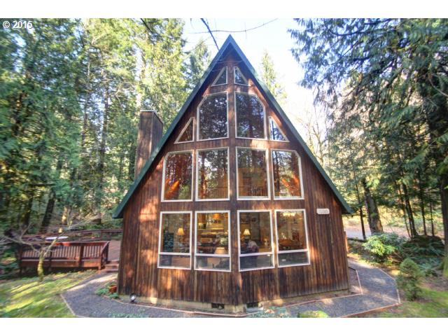 70385 East Zig Zag River Road Rhododendron, OR 97049 - Photo 1 of 16 a view of a house with a yard