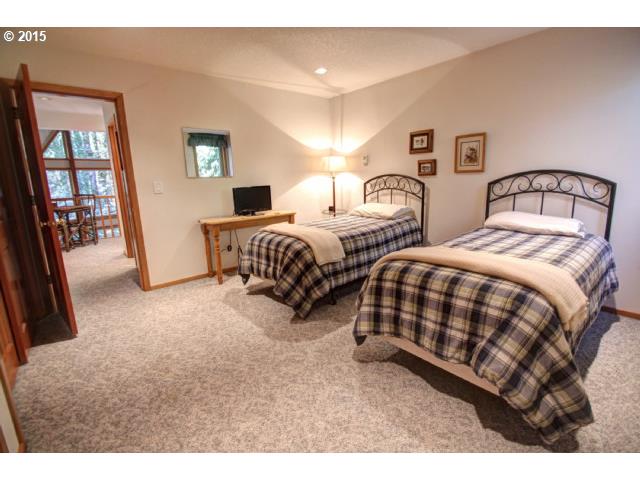 70385 East Zig Zag River Road Rhododendron, OR 97049 - Photo 13 of 16 a bedroom with two beds and painting on the wall