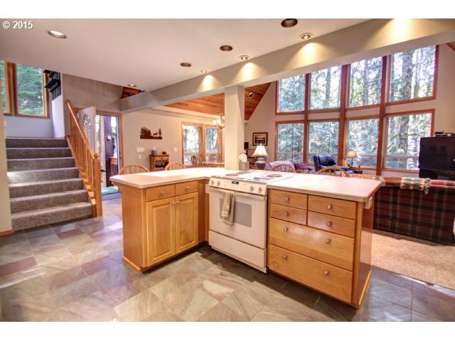 70385 East Zig Zag River Road Rhododendron, OR 97049 - Photo 7 of 16 a kitchen that has a sink and a stove with wooden floor