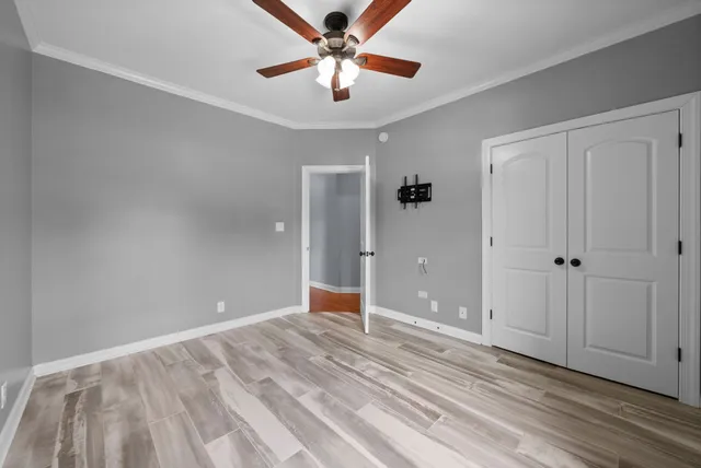 a bathroom with a double vanity sink toilet and a mirror
