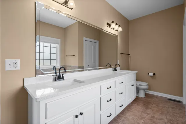 a bathroom with a sink and mirror