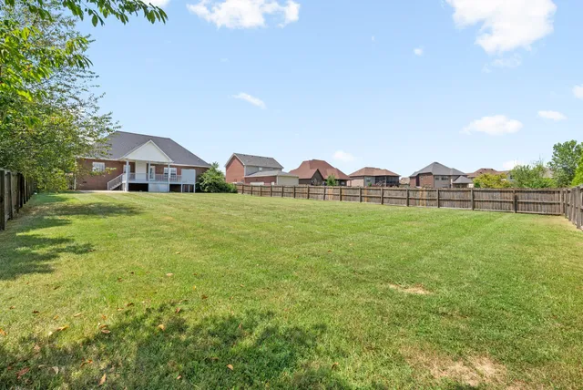 a backyard of a house with lots of green space